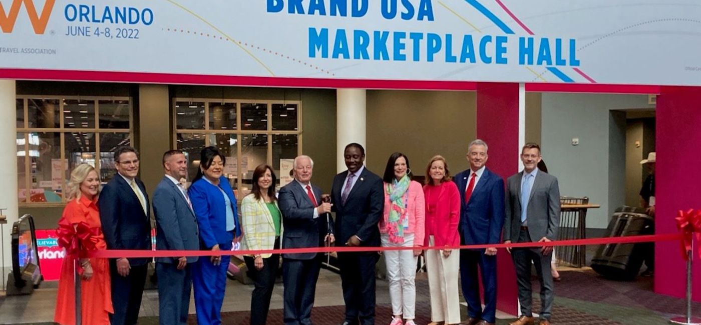 Image: U.S. Travel Association president Roger Dow (centre left), cuts the ribbon to open the 53rd IPW, alongside Orange County mayor Jerry Demings. (Marsha Mowers)