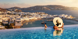 Luxury travel, luxury travelers, infinity pool, wine, Mykonos, Greece