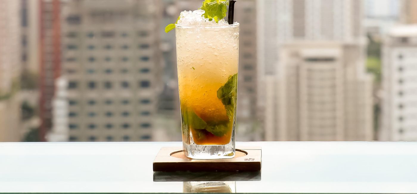 Image: PHOTO: Mojito cocktail at a rooftop bar. (photo via SAKDAWUT14/iStock/Getty Images Plus)