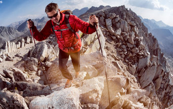 A man hiking the Sierra Nevada mountain range in California.