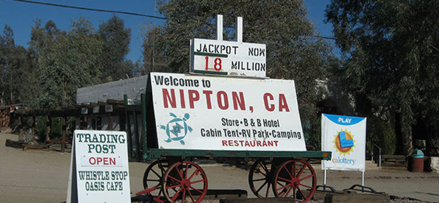 Image: PHOTO: Nipton, California's welcome wagon. (photo via Flickr/Ken Lund)