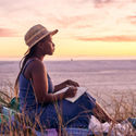 woman, beach, people, travel journal, journal, journaling, woman journaling, woman on beach, travel journaling