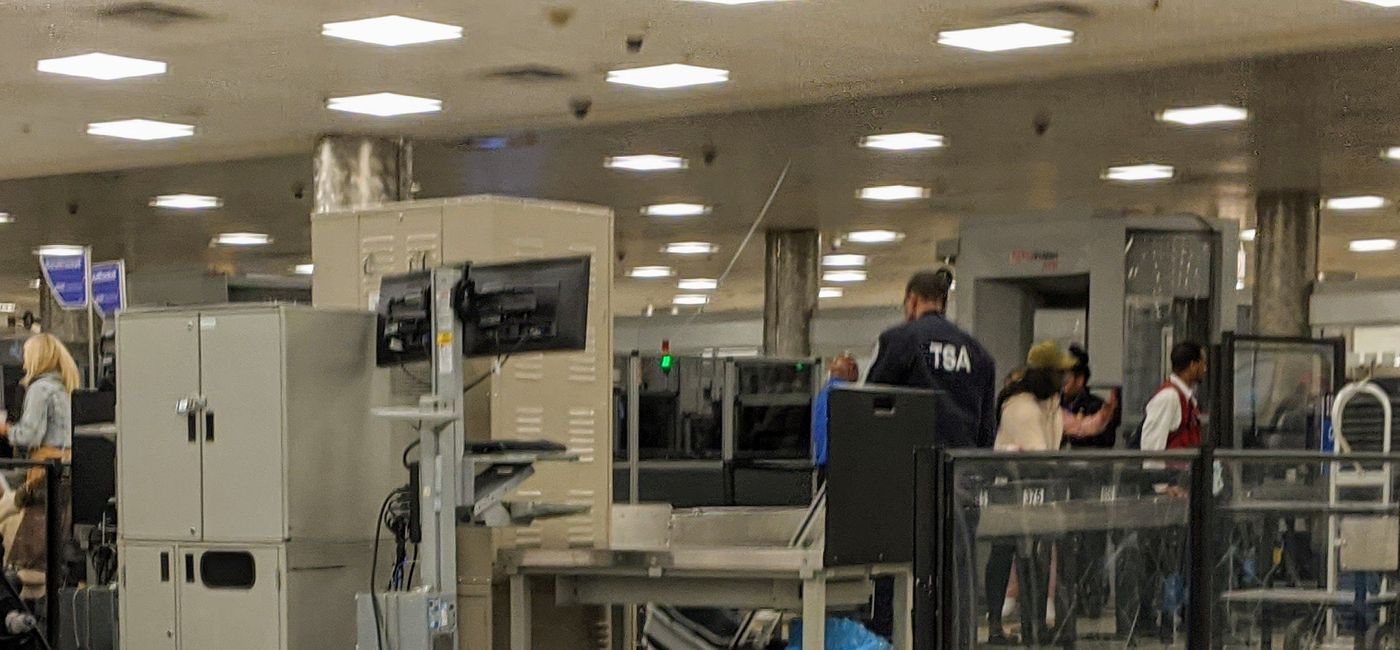 Image: Travelers go through TSA security line (photo by Eric Bowman)