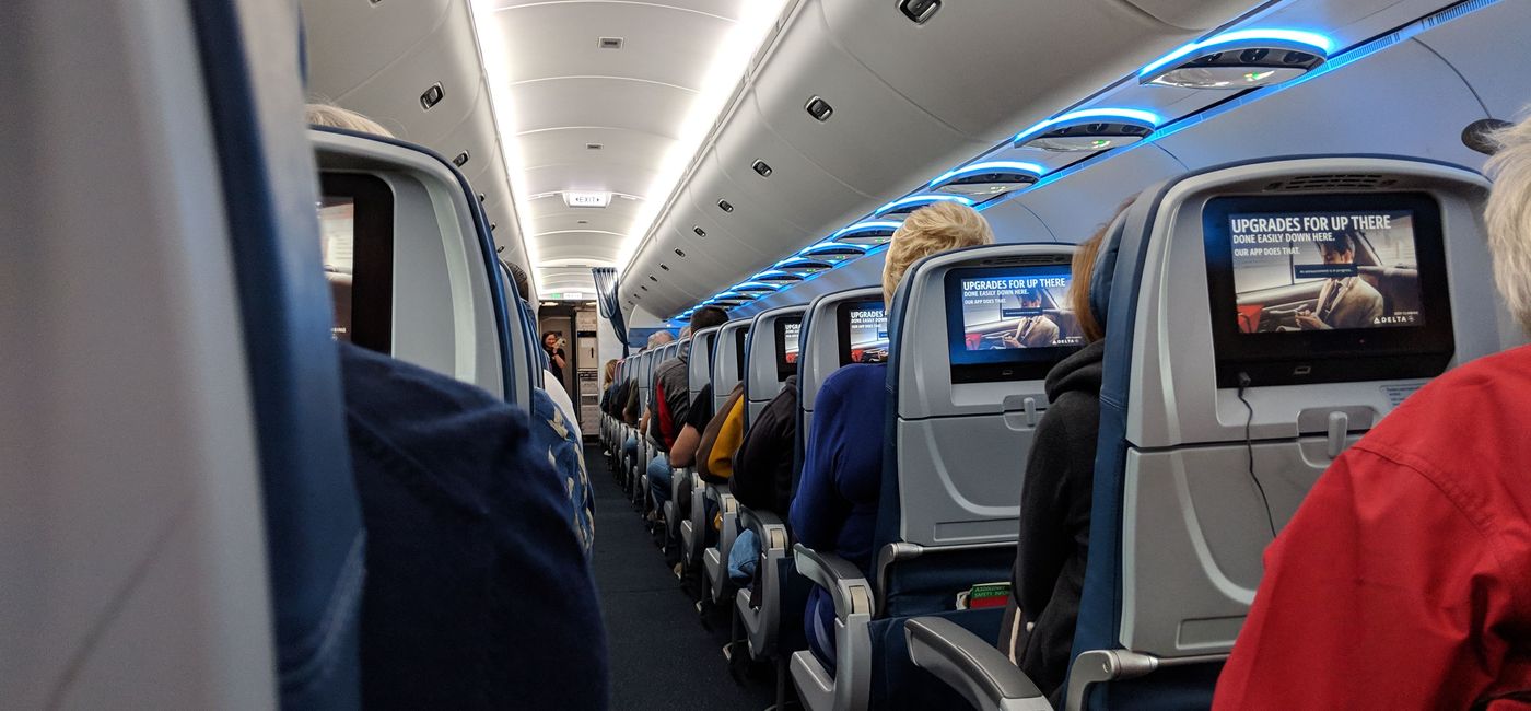 Image: Passengers seated on an airplane. (Eric Bowman)
