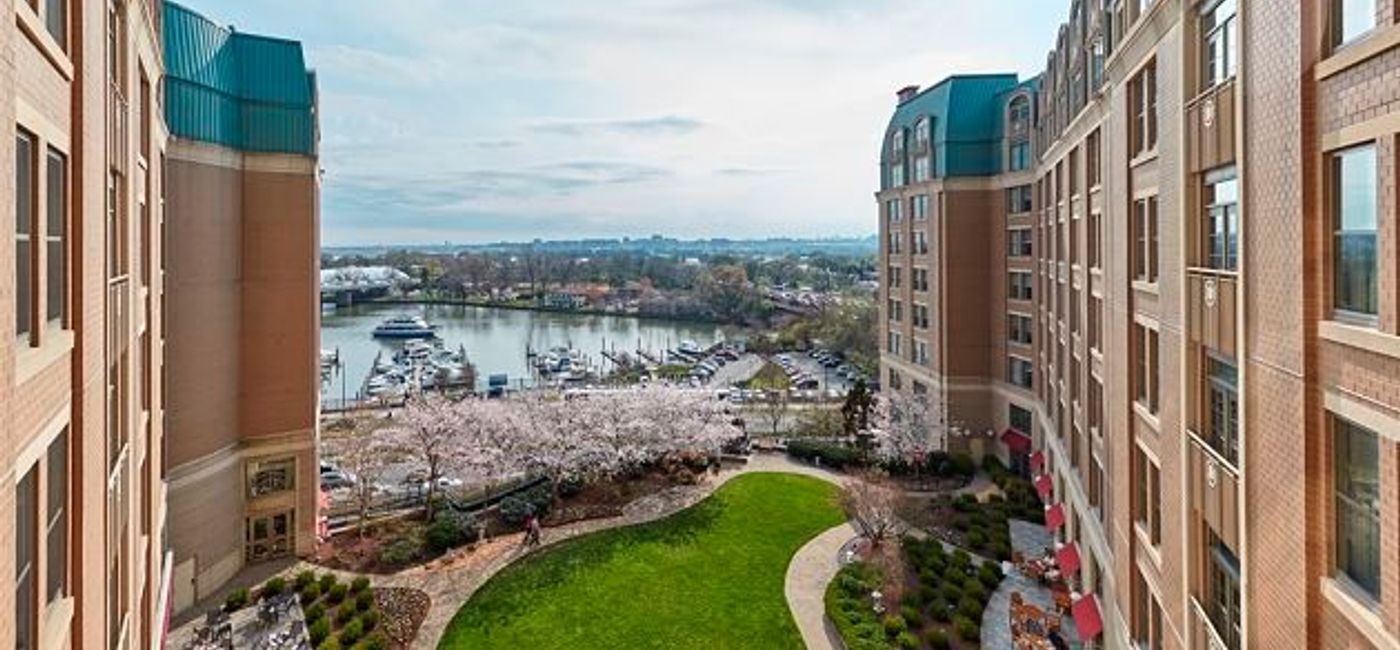 Image: PHOTO: Mandarin Oriental Washington DC with cherry blossoms in full bloom. (photo courtesy of Mandarin Oriental, Washington DC) 