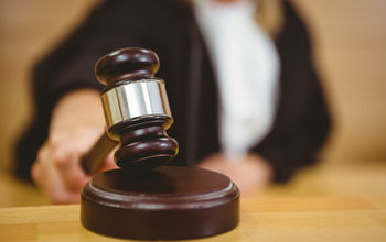 Judge with gavel.