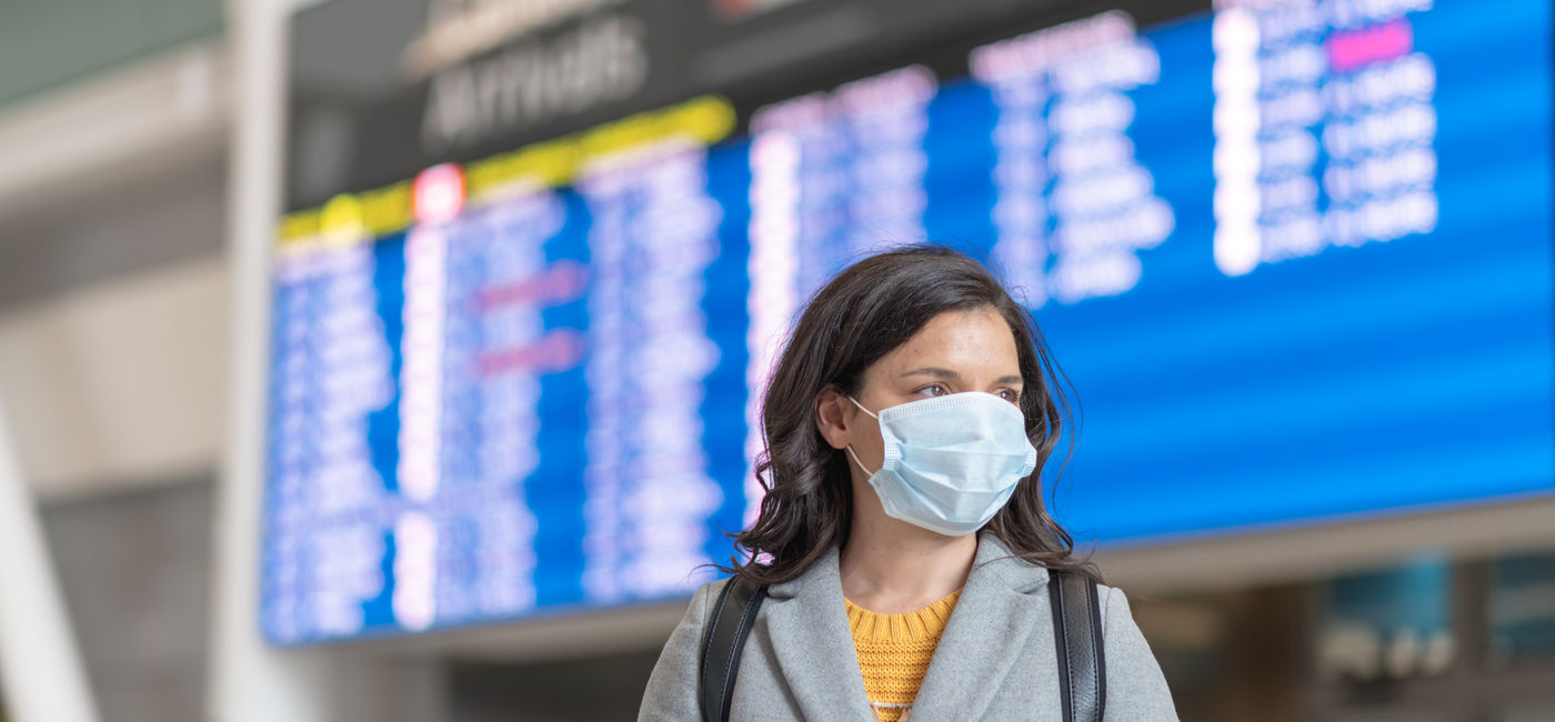 Image: PHOTO: Traveling at the airport during the COVID-19 pandemic. (photo via Fly View Productions/Getty Images)