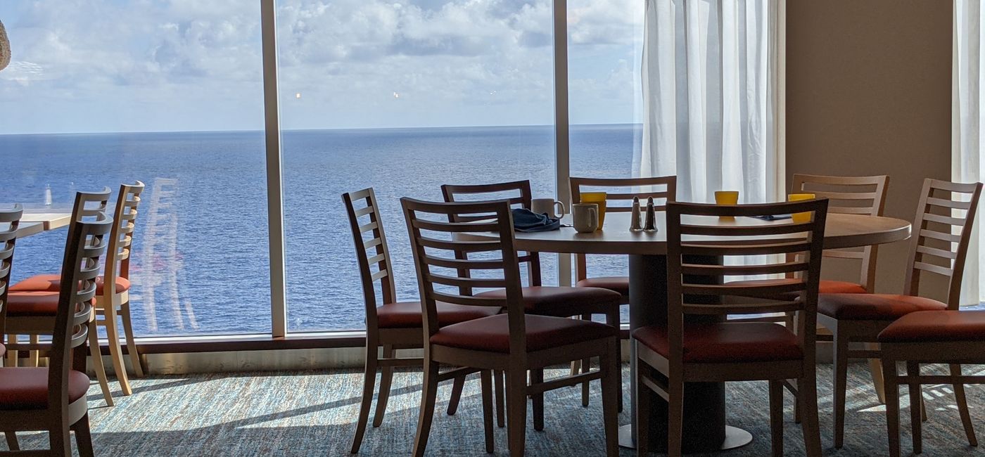 Image: Indoor dining tables on Carnival Mardi Gras cruise ship (photo by Eric Bowman)