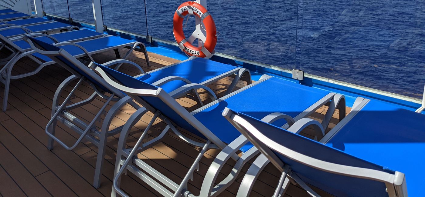 Image: Cruise ship lounge chairs facing the ocean (photo by Eric Bowman)