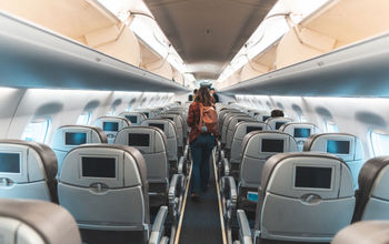 Woman exiting an airplane