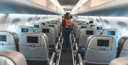 Woman exiting an airplane