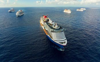 Carnival ships meet at sea.