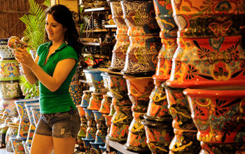 A woman browses locally made painted pottery in Guanajuato