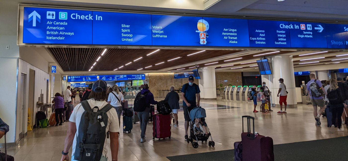 Image: Travelers at the airport (photo by Eric Bowman)