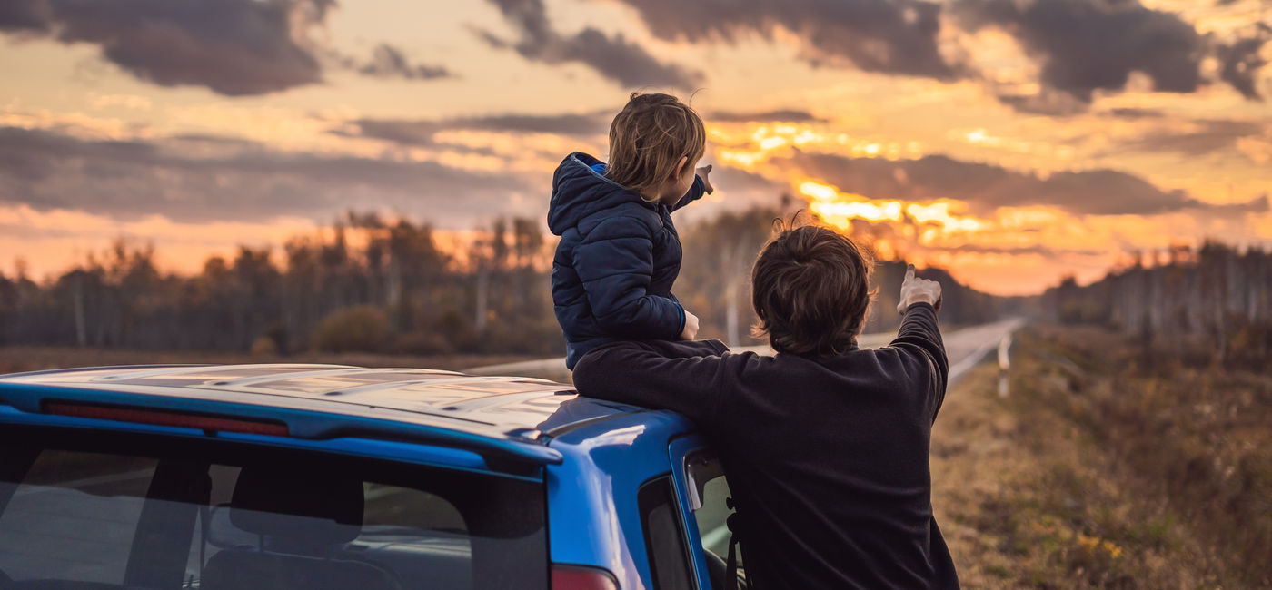 Image: Dad and son on a road trip. (photo via galitskaya / iStock / Getty Images Plus)