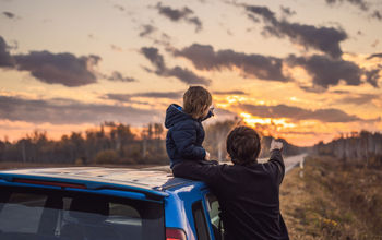 Dad and son on a road trip.