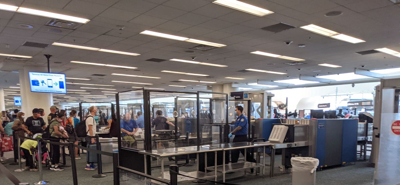 Image: Line of travelers waiting to go through airport security (photo by Eric Bowman)