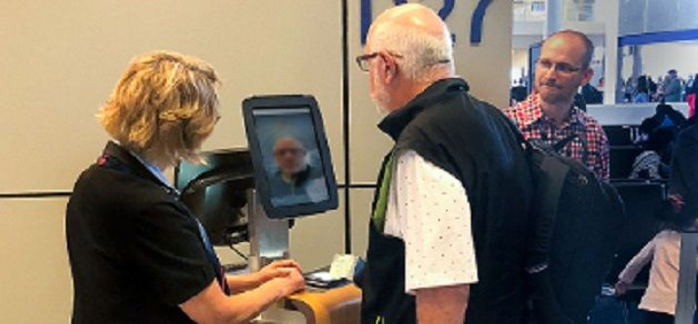 Image: PHOTO: Customer boards flight at DFW using the airport’s new biometric boarding technology. (photo courtesy of American Airlines)