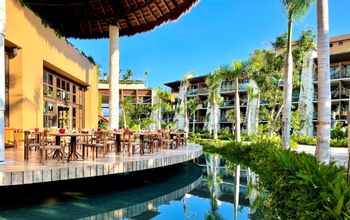 Outdoor restaurant seating at Hotel Xcaret Arte