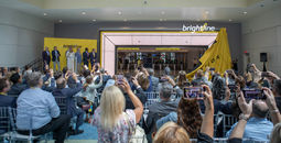 Brightline officials and local dignitaries watch as the Brightline Orlando Station is unveiled