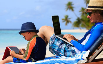 Family on laptops at Palace Resorts