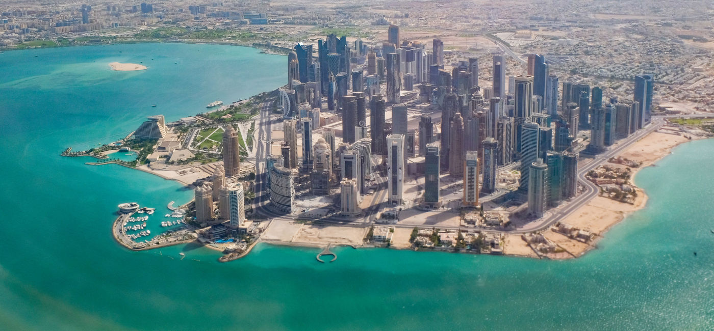 Image: Doha, Qatar from the air. (photo via ronemmons/iStock/Getty Images Plus)