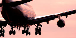 Boeing 747 landing into sunset.