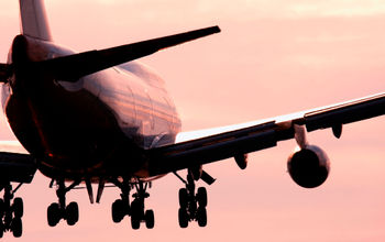 Boeing 747 landing into sunset.