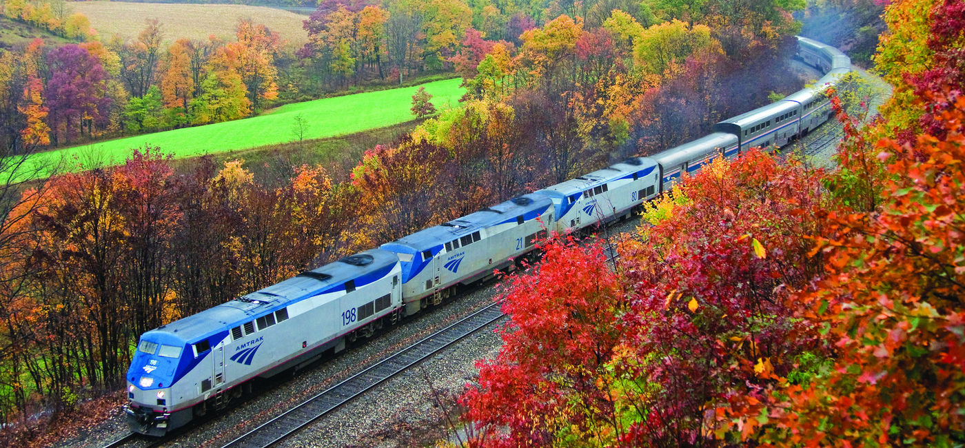 Image: Amtrak's Capitol Limited travels through the Allegheny Mountains between Pittsburgh and Cumberland during peak fall foliage season. (Photo courtesy of Amtrak) ((photo via Amtrak))