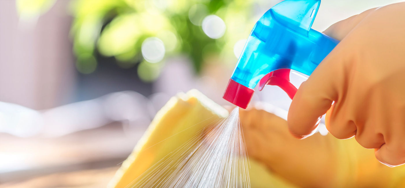Image: PHOTO: A person disinfecting a surface in their home. (photo via BrianAJackson/iStock/Getty Images Plus)