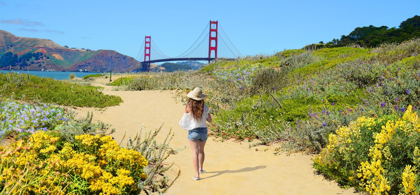 Image: PHOTO: Woman hiking near the Golden Gate Bridge in San Francisco. (photo via MargaretW/iStock/Getty Images Plus)