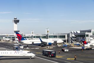 A Delta Air Lines plane at the gate at New York City's John F Kennedy International Airport