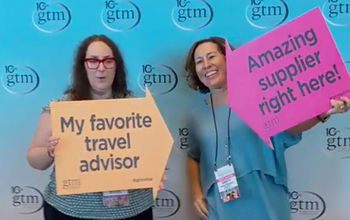Travel advisor and supplier pose together at Global Travel Marketplace