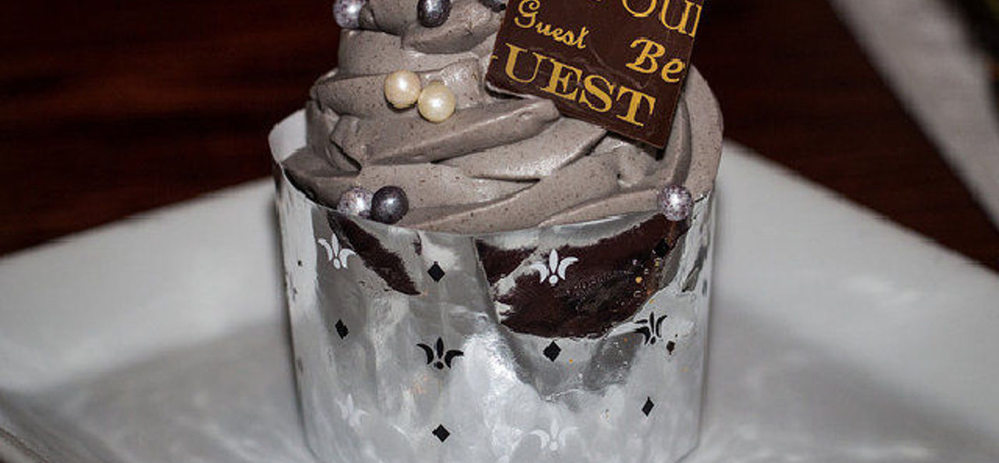 Image: PHOTO: At Be Our Guest Restaurant: The Master's Cupcake - Chocolate Sponge Cake topped with Lumiere’s special 'Grey Stuff.' (photo via Flickr/Anna Fox)