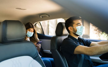 A driver and passenger using a ride-hailing provider.