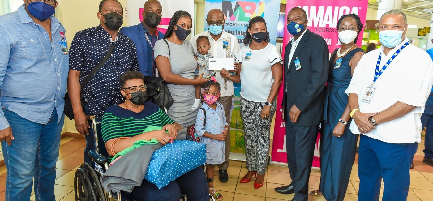 Image: Jamaica tourism officials welcomed Daynel Williams (second from left), the country's one millionth visitor since reopening in June 2020. (Courtesy of Jamaica Tourist Board)