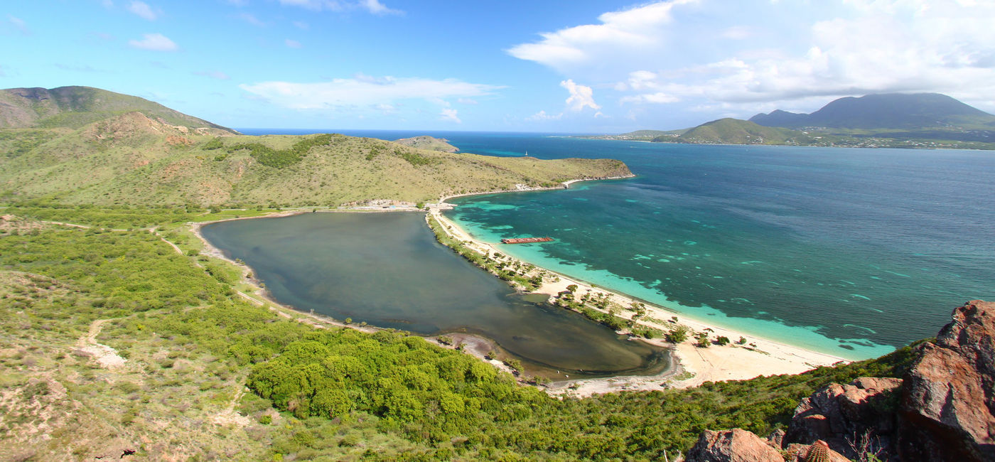 Image: Majors Bay Beach, St Kitts. (photo via Wirepec/iStock/Getty Images Plus)