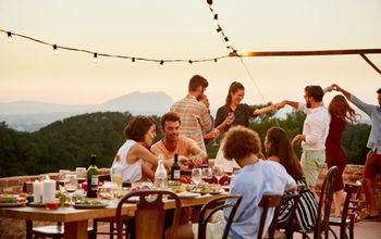 Multi ethnic friends enjoying at patio during social gathering
