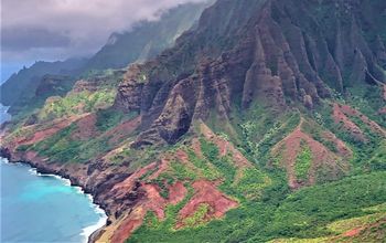 Red Green mountains and blue turquoise ocean