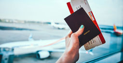 Passport and plane ticket before boarding plane.