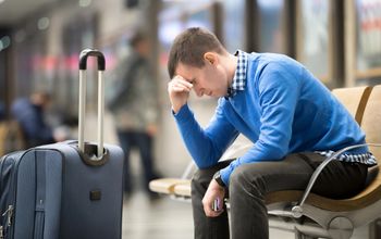 Young frustrated man at airport