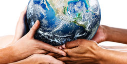 Diverse hands holding the Earth