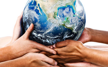 Diverse hands holding the Earth