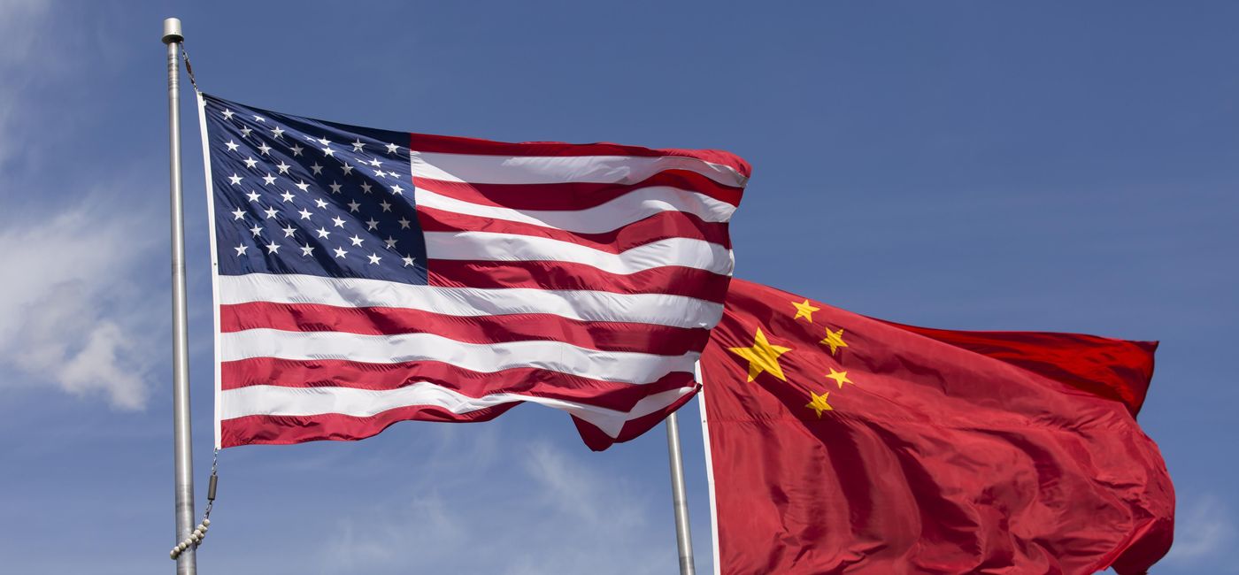 Image: American and Chinese flags fly together (photo via cbarnesphotography / iStock / Getty Images Plus)