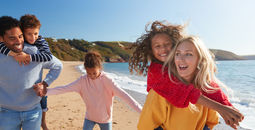 Family having fun on the beach together