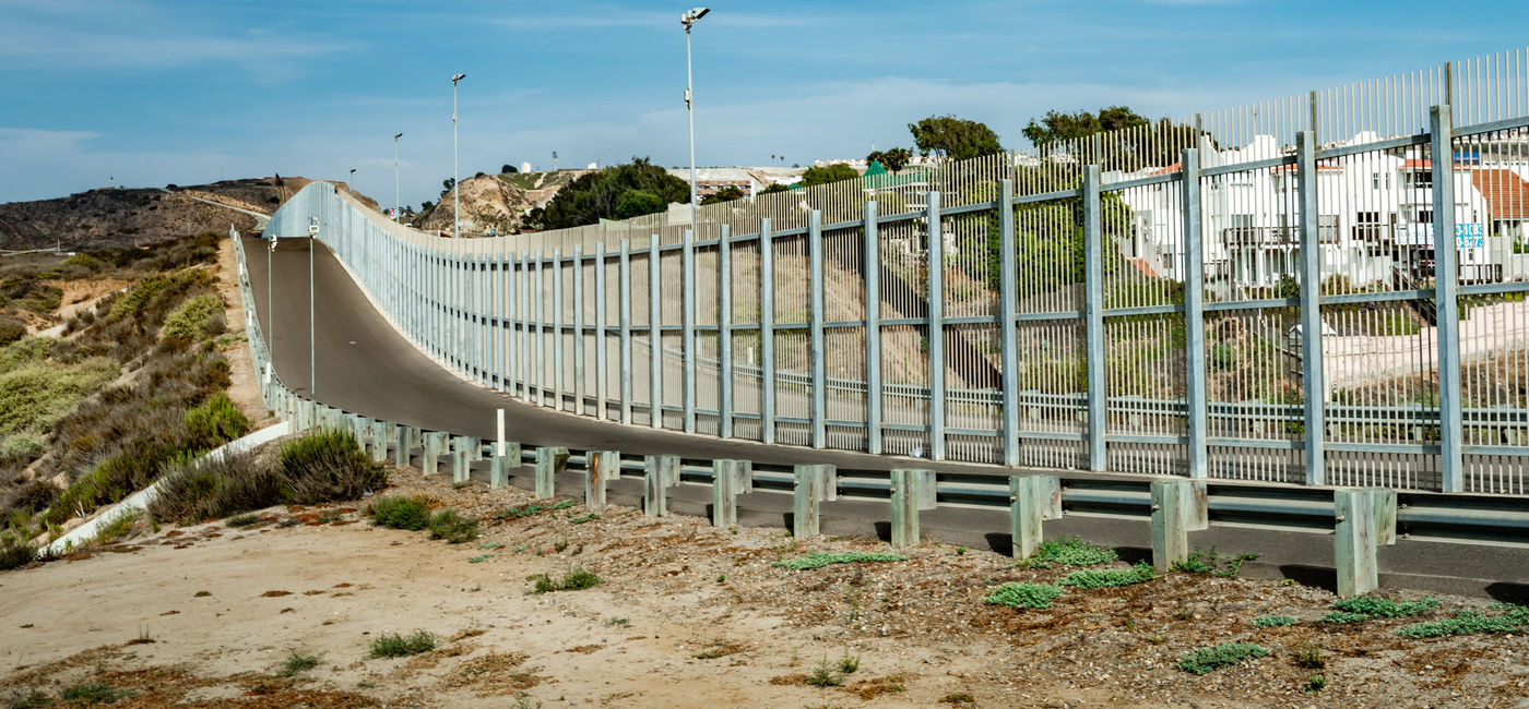 Image: PHOTO: US-Mexico Border Fence in California. (photo via Photos597 / iStock / Getty Images Plus)