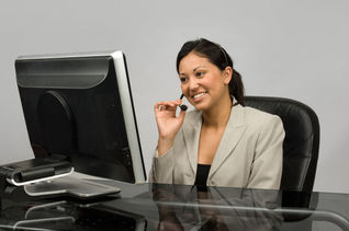 Customer service agent using a phone headset.