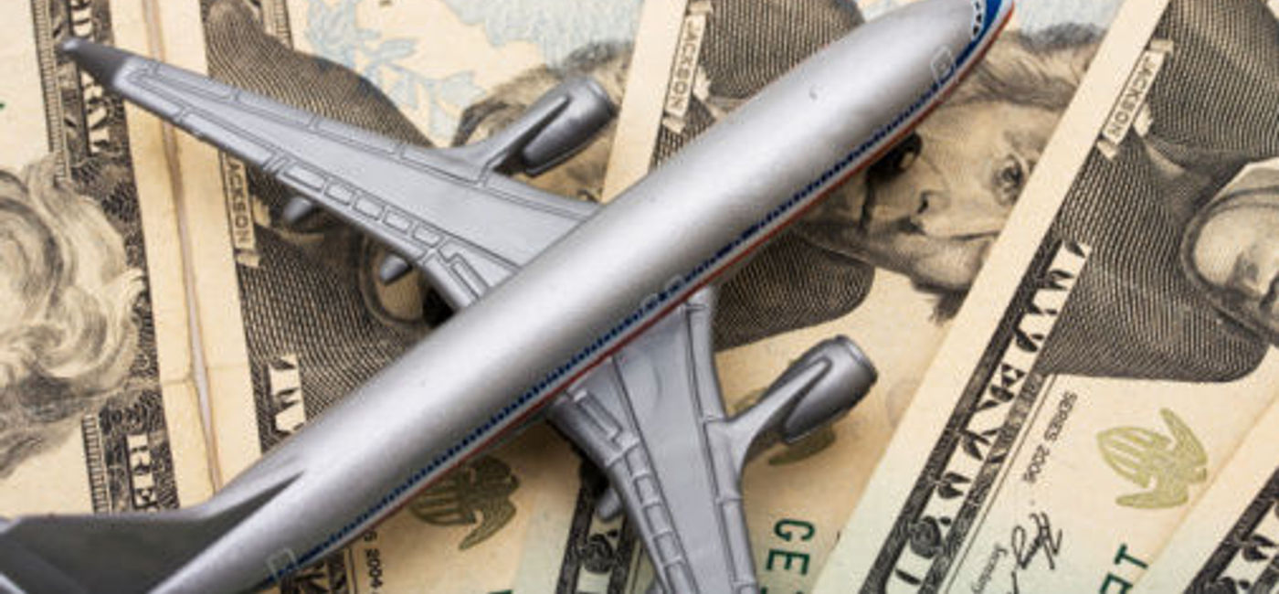 Image: PHOTO: Plane model on money. (photo courtesy of Thinkstock)