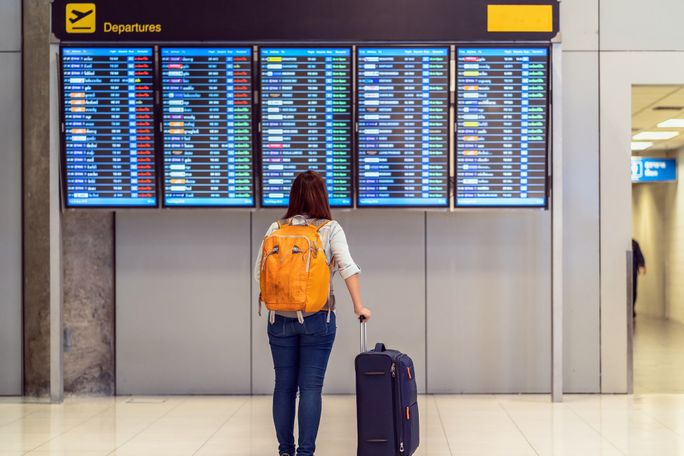 Passenger checking the flight schedule