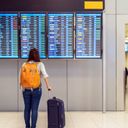 Passenger checking the flight schedule